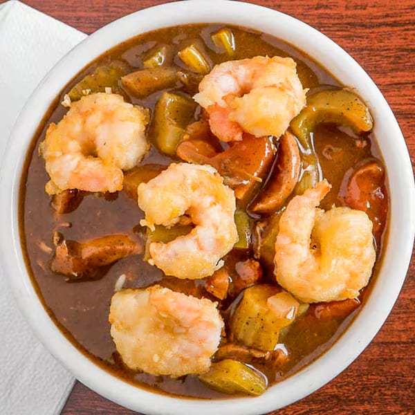 Louisiana Famous Fried Chicken's shrimp gumbo, featuring crispy fried shrimp, okra, and a rich brown broth.
